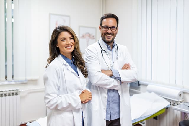 Two Bioceutix clinicians standing together in a treatment room